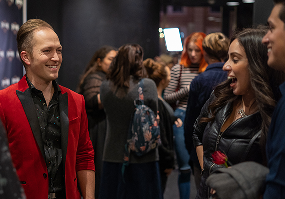 Magician Ryne Strom interacting with audience after his show